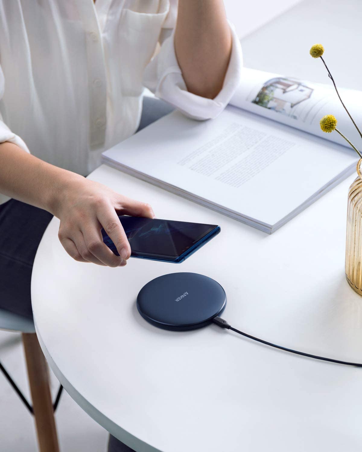 Anker 313 Wireless Charger pad with a sleek design, ideal for charging compatible devices efficiently.