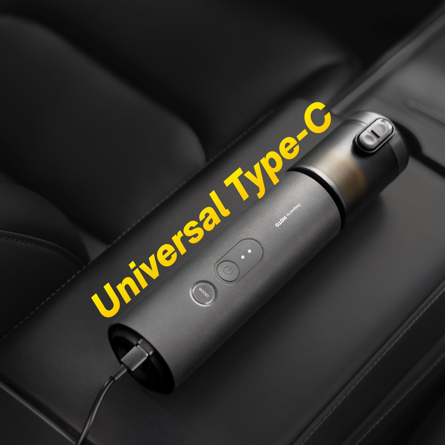 HOTO AutoCare Air Duster and Vacuum charging on a sleek surface, showcasing its compact design and modern features.