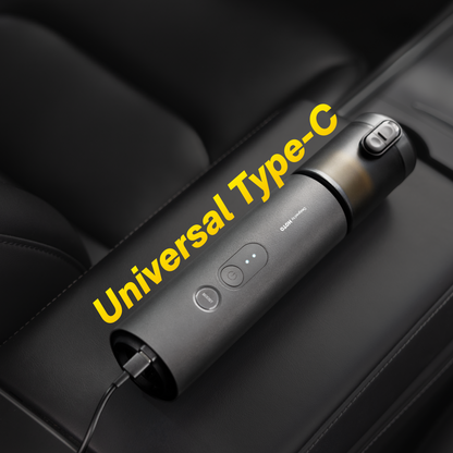 HOTO AutoCare Air Duster and Vacuum charging on a sleek surface, showcasing its compact design and modern features.