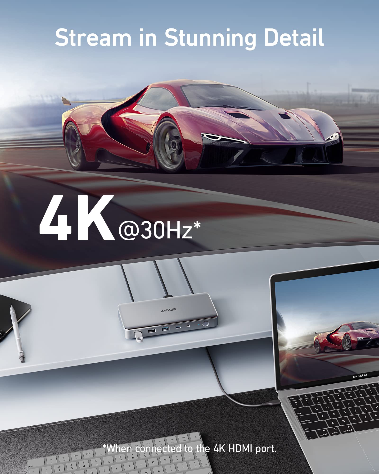 Laptop displaying a red sports car on screen with text about 4K resolution.