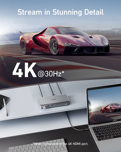 Laptop displaying a red sports car on screen with text about 4K resolution.